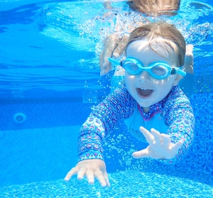 Toddler swimming under water in Water Mill